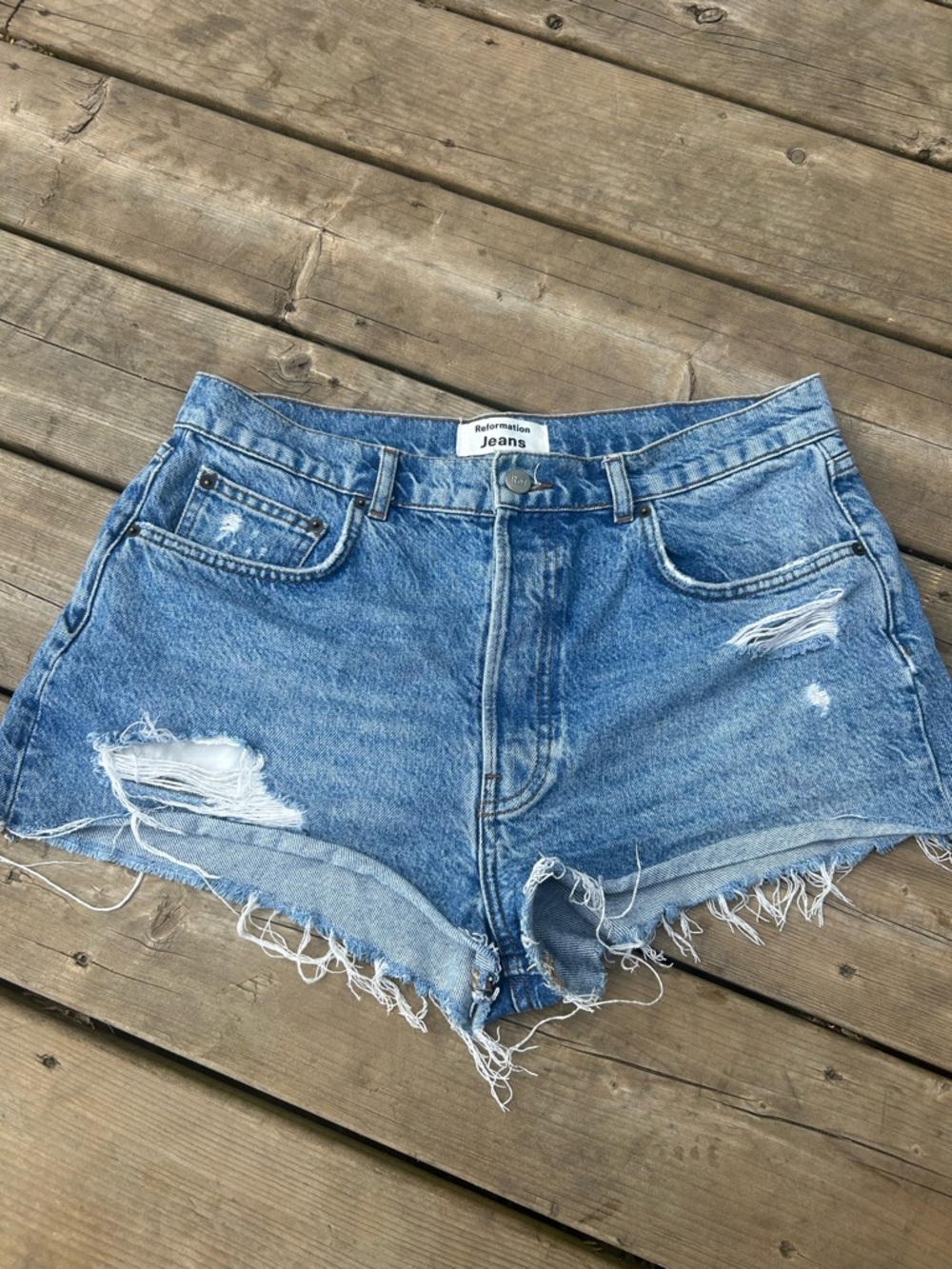 Reformation high-rise denim shorts distressed and raw, frayed hem sz 30